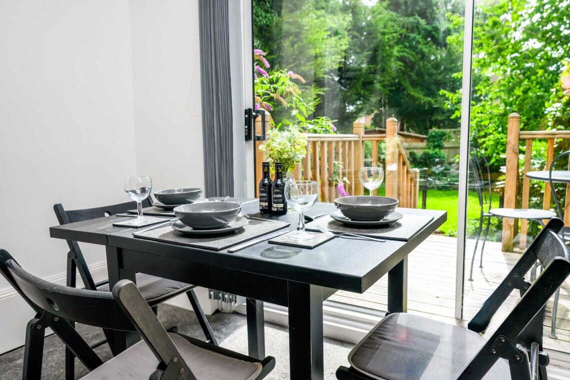 Open plan living area with easy access  the decking and garden 